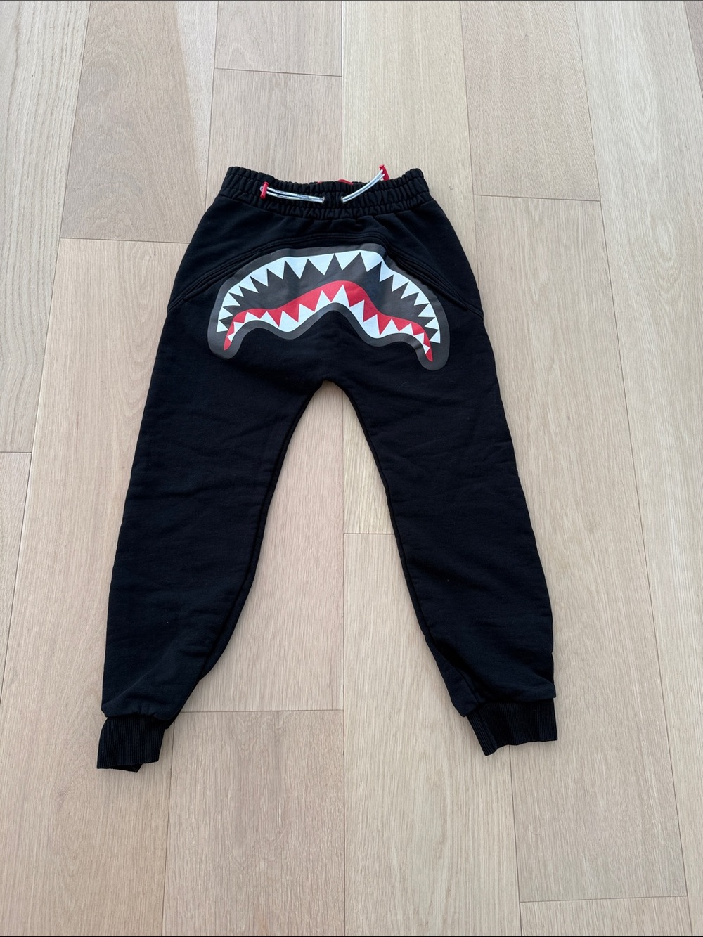 Sprayground Kids Black Joggers with Red & White Shark Mouth